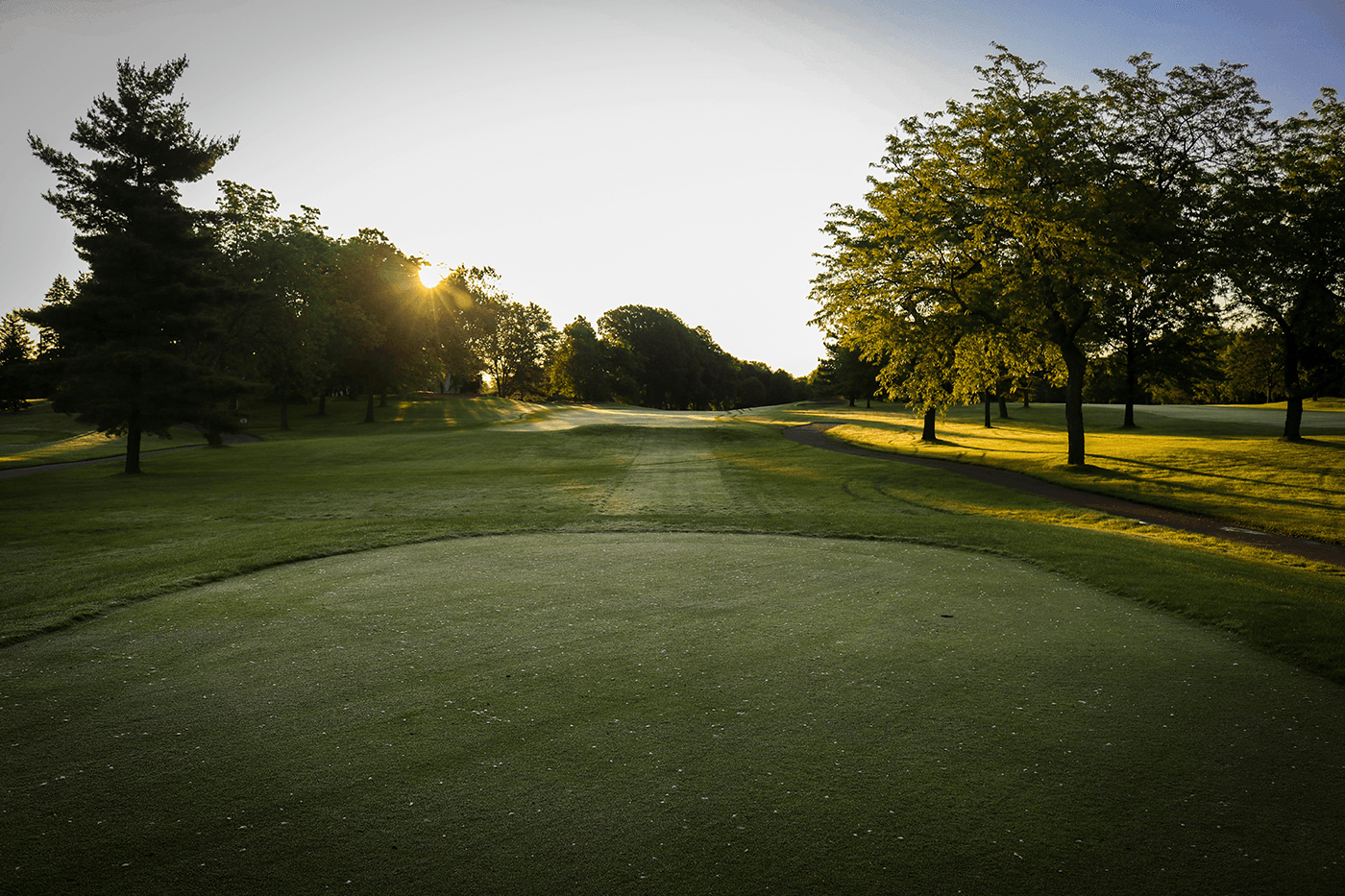 Background image of hero section depicting a golf course.